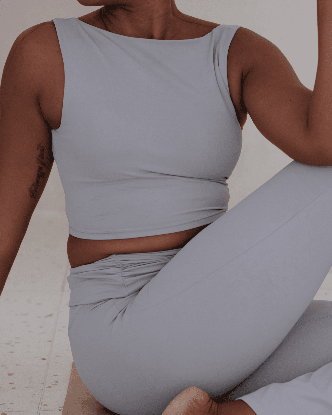 Pilates client in light blue activewear